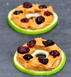 Apples slices with peanut butter and raisins